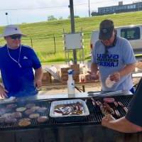 Alumni cooks at grill